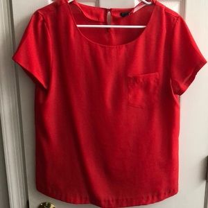 Red short sleeve blouse with front left pocket